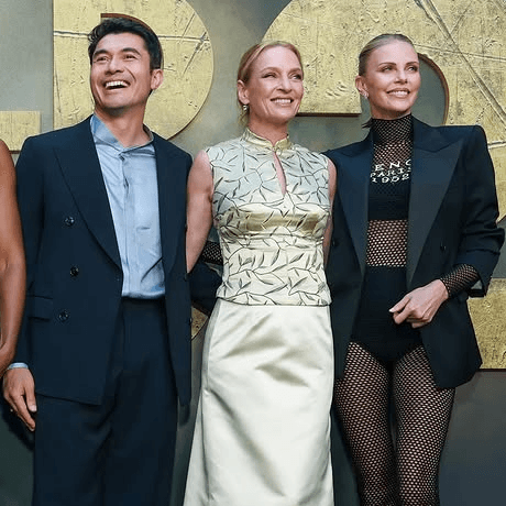 Henry Golding Calls Charlize Theron “The Female Tom Cruise” Ahead of The Old Guard 2 Release on Netflix